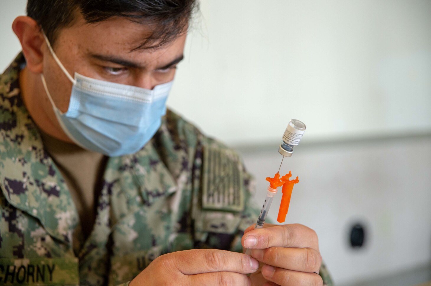ASailor assigned to Naval Medical Center San Diego (NMCSD), prepares a single coronavirus (COVID-19) vaccine at Naval Base Point Loma�s (NBPL) Admiral Kidd Center.