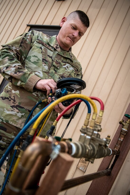 Tech. Sgt. Jeff Marshall, 932nd Civil Engineer Squadron water and fuels system craftsman, performs service checks on equipment used for servicing water and fuel systems April 10 2021, Scott Air Force Base, Illinois. (U.S. Air Force photo by Master Sgt. Christopher Parr)