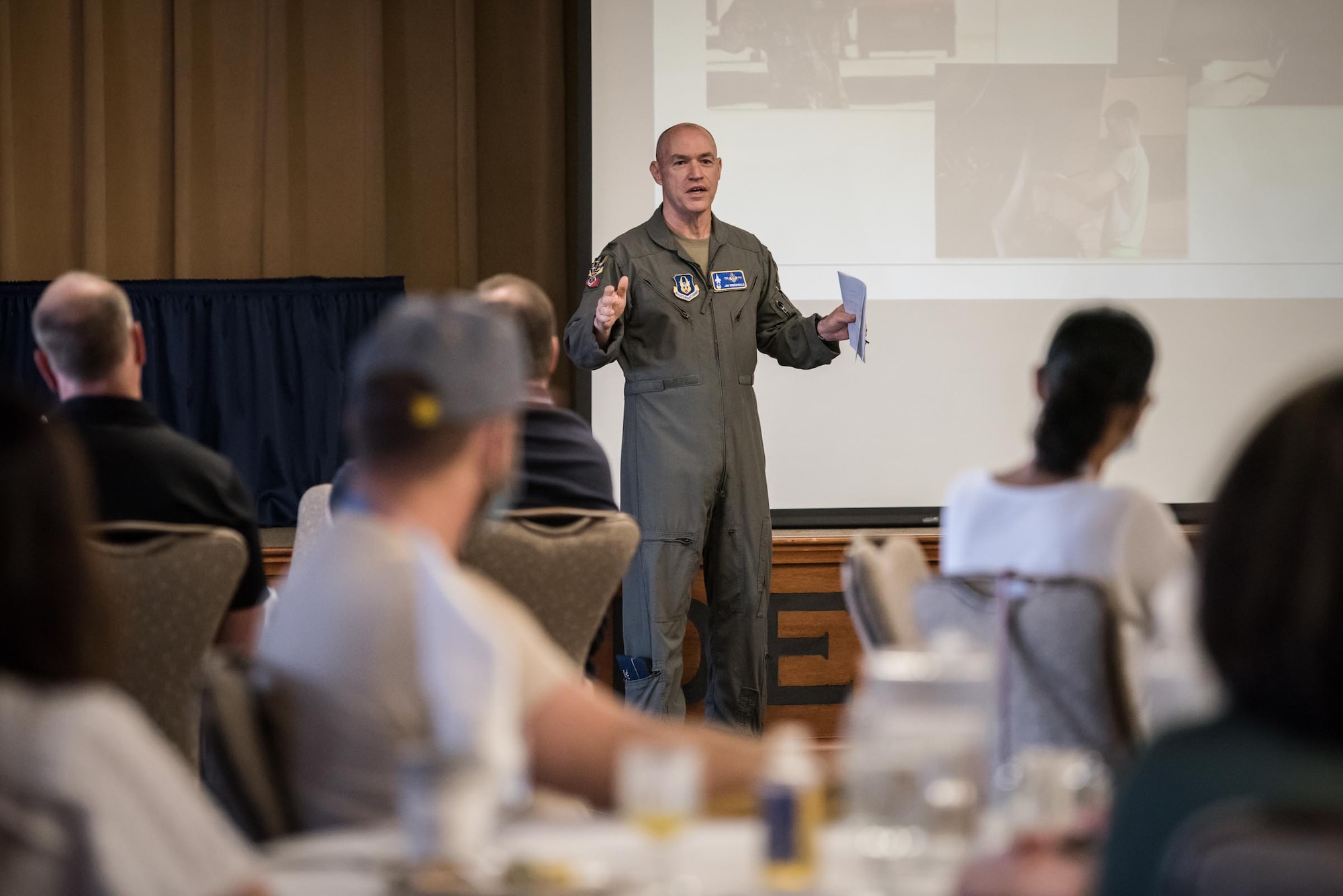 Col. James Greenwald, 944th Fighter Wing commander, briefs employers of 944th FW Reserve Citizen Airmen during the 944th FW Employer Day 2021 at Luke Air Force Base, Ariz., April 10, 2021. The employers saw everything from a field kitchen and security forces tactics demonstrations, to weapons, aircraft maintenance, and up-close views of an F-35 Lightning II and F-16 Fighting Falcon.