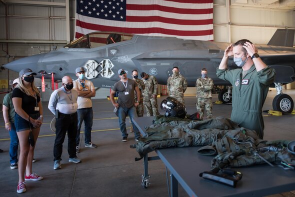Maj. Aaron Stevens, an F-35 Lightning II pilot with the 944th Operations Group, briefs employers of 944th Fighter Wing Reserve Citizen Airmen during the 944th FW Employer Day 2021 at Luke Air Force Base, Ariz., April 10, 2021. The employers toured a field kitchen, watched security forces tactics demonstrations, and received briefings on weapons, aircraft maintenance, and the F-35 Lightning II and F-16 Fighting Falcon aircraft.