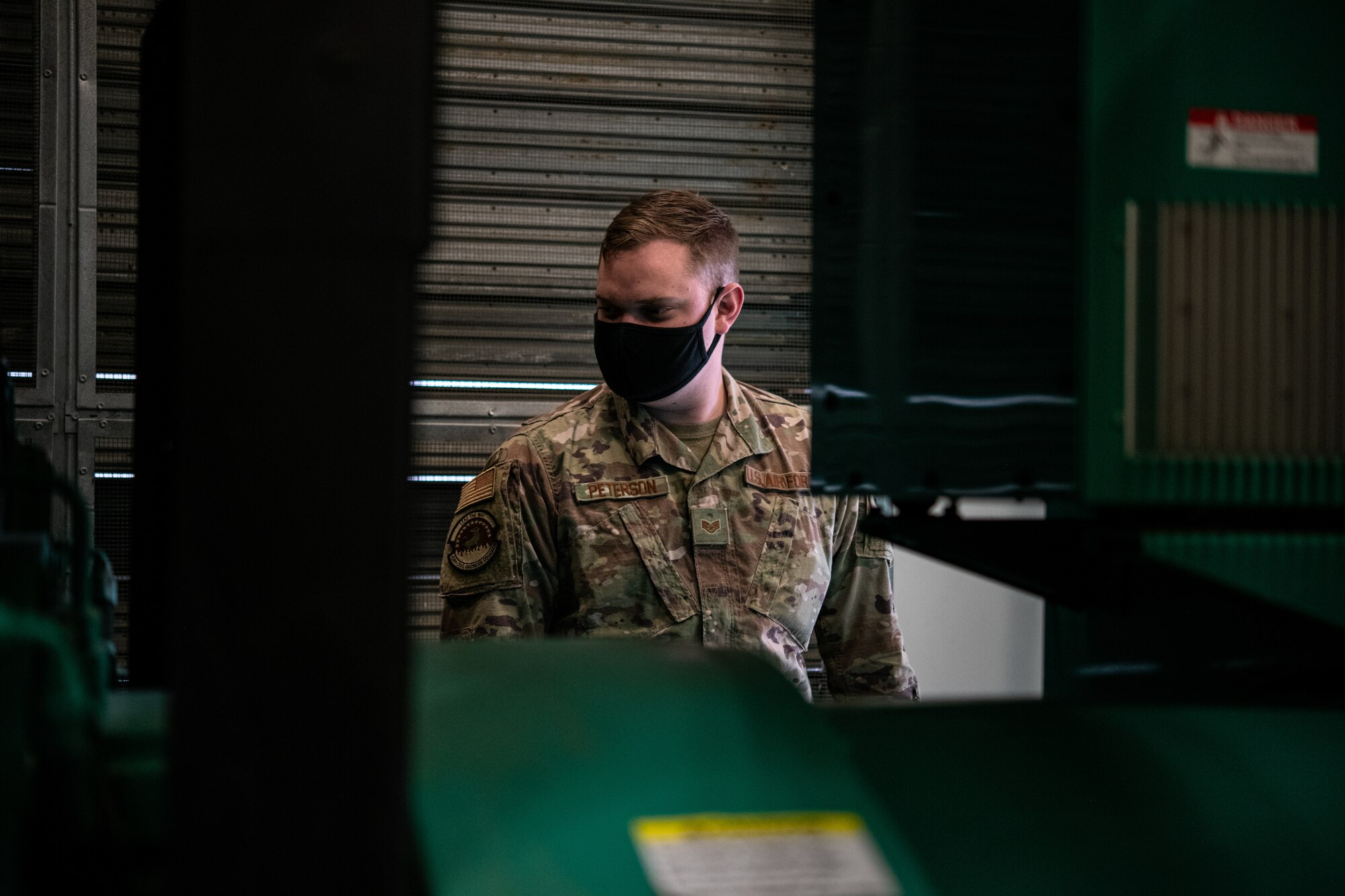 Staff Sgt. David Peterson, 436th Civil Engineer Squadron electrical power production craftsman, inspects a generator at Dover Air Force Base, Delaware, April 12, 2021. Post-test checks are conducted during preventative maintenance after the generator runs for an hour. (U.S. Air Force photo by Senior Airman Marco A. Gomez)