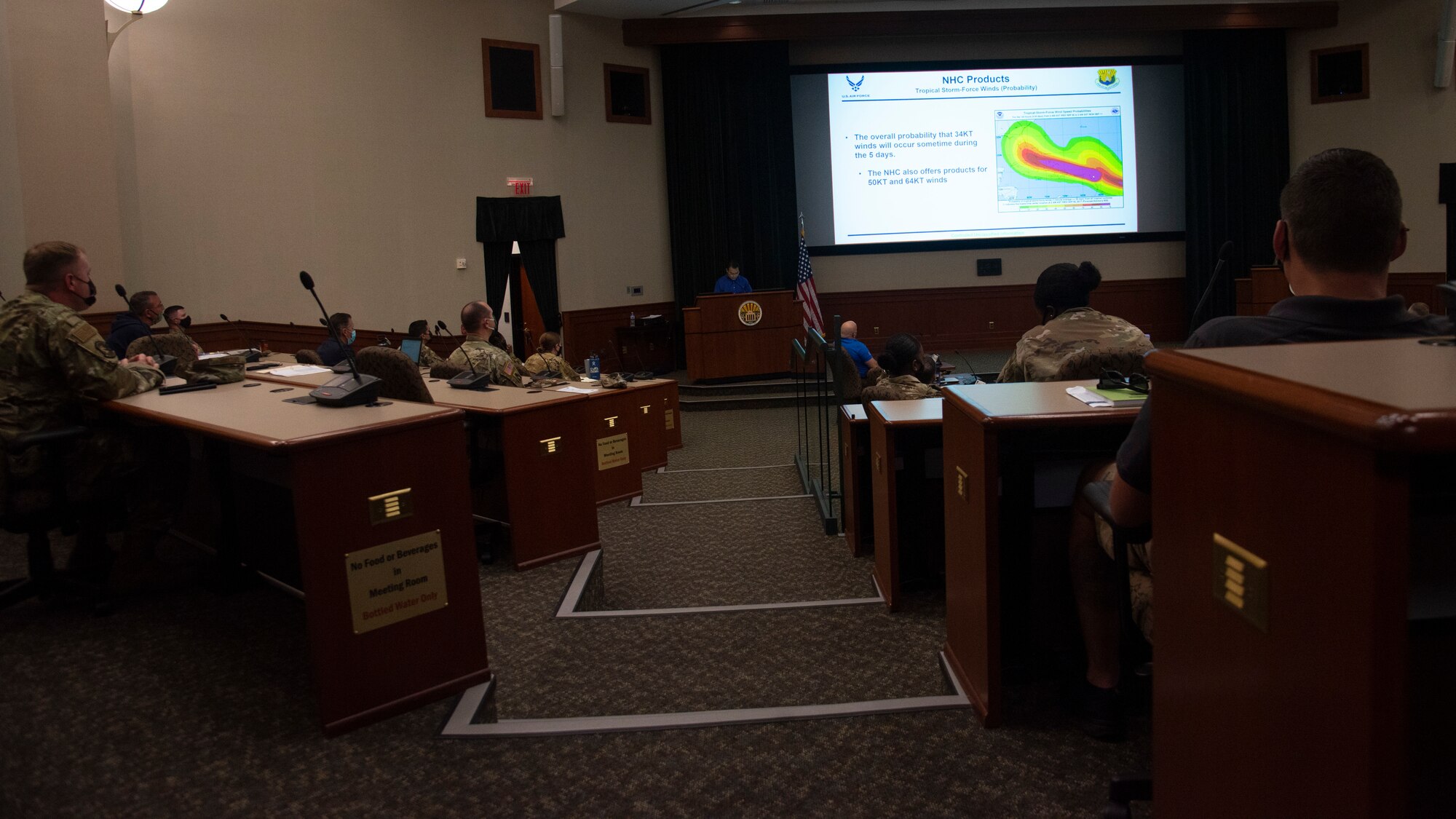 Personnel assigned to MacDill Air Force Base, Fla., attend a briefing during a joint force hurricane exercise, April 20, 2021.