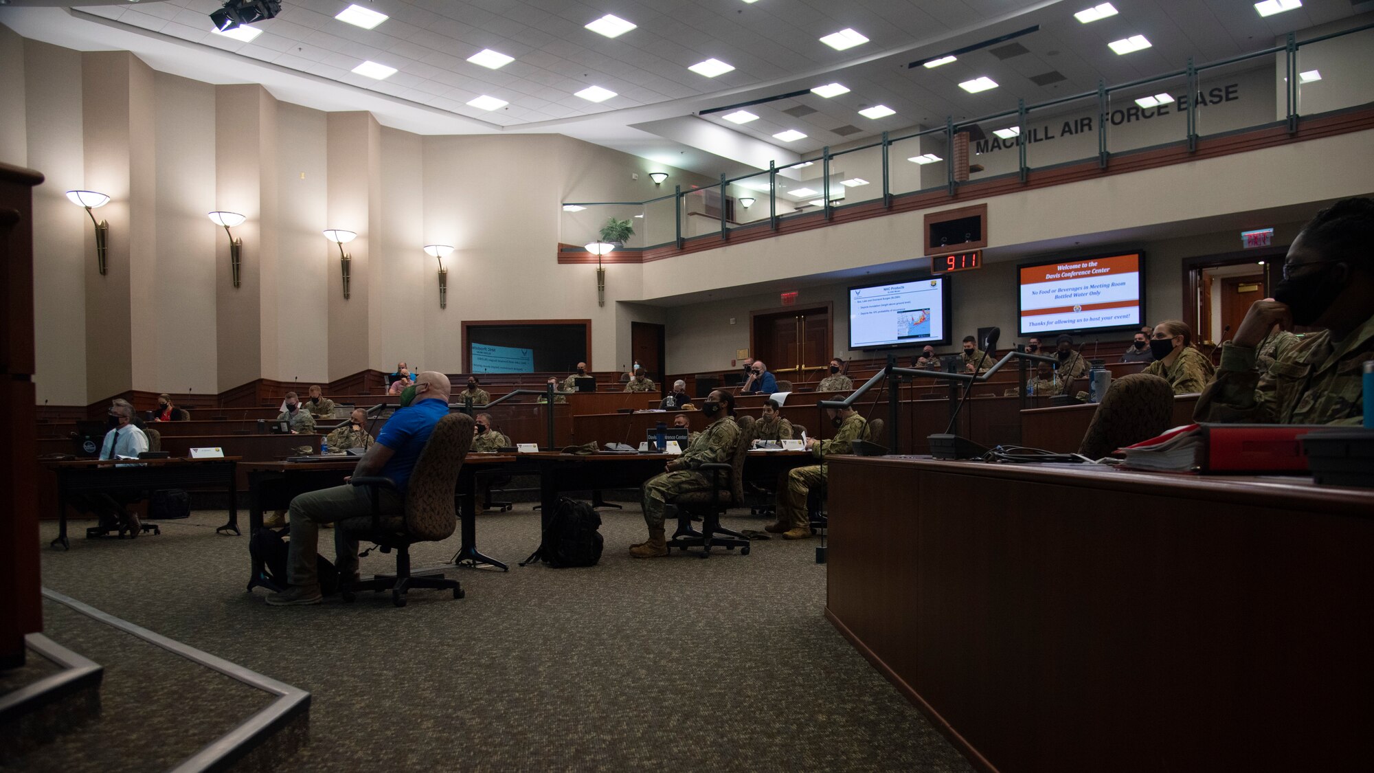 Personnel assigned to MacDill Air Force Base, Fla., attend a briefing during a joint force hurricane exercise, April 20, 2021.