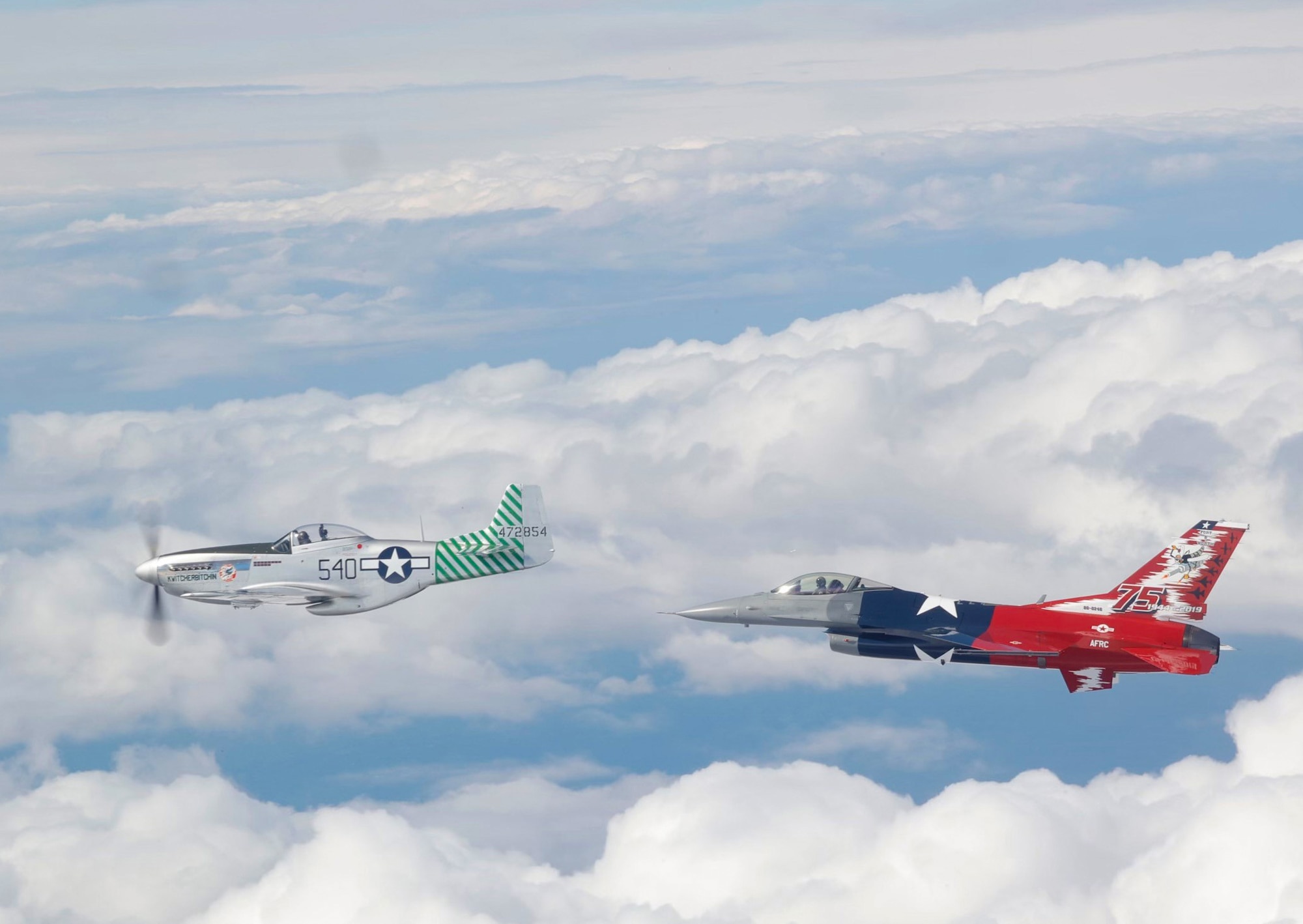 A P-51 Mustang and a 457th Fighter Squadron F-16 Fighting Falcon fly over the east coast of the United States Friday, April 16, 2021. The flight commemorated the 75th anniversary of the squadron, which was activated on Oct. 21, 1944. The P-51 was the first aircraft assigned to the squadron. (U.S. Air Force photo by 1st Lt. Savanah Bray)