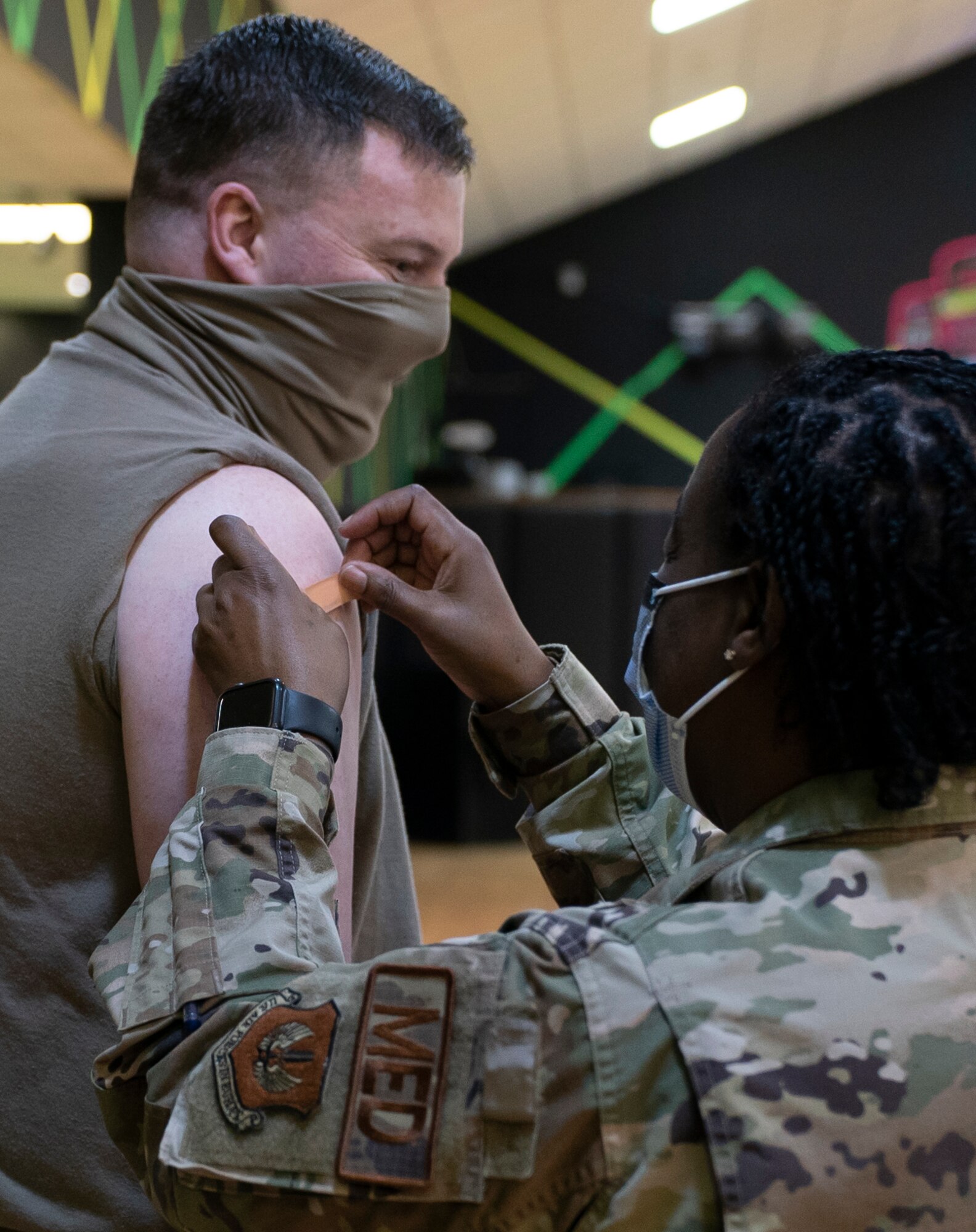 U.S. Air Force Tech. Sgt. Christopher Rex, 48th Contracting Squadron contract specialist, received the 10,000th COVID-19 vaccine to be administered by the 48th Medical Group at  Royal Air Force Lakenheath, England, April 16, 2021. Personnel were prioritized to receive the vaccine based on the guidance from the Centers for Disease Control and Prevention and on the DoD COVID Task Force’s assessment of unique DoD mission requirements. (U.S. Air Force photo by Airman 1st Class Jessi Monte)