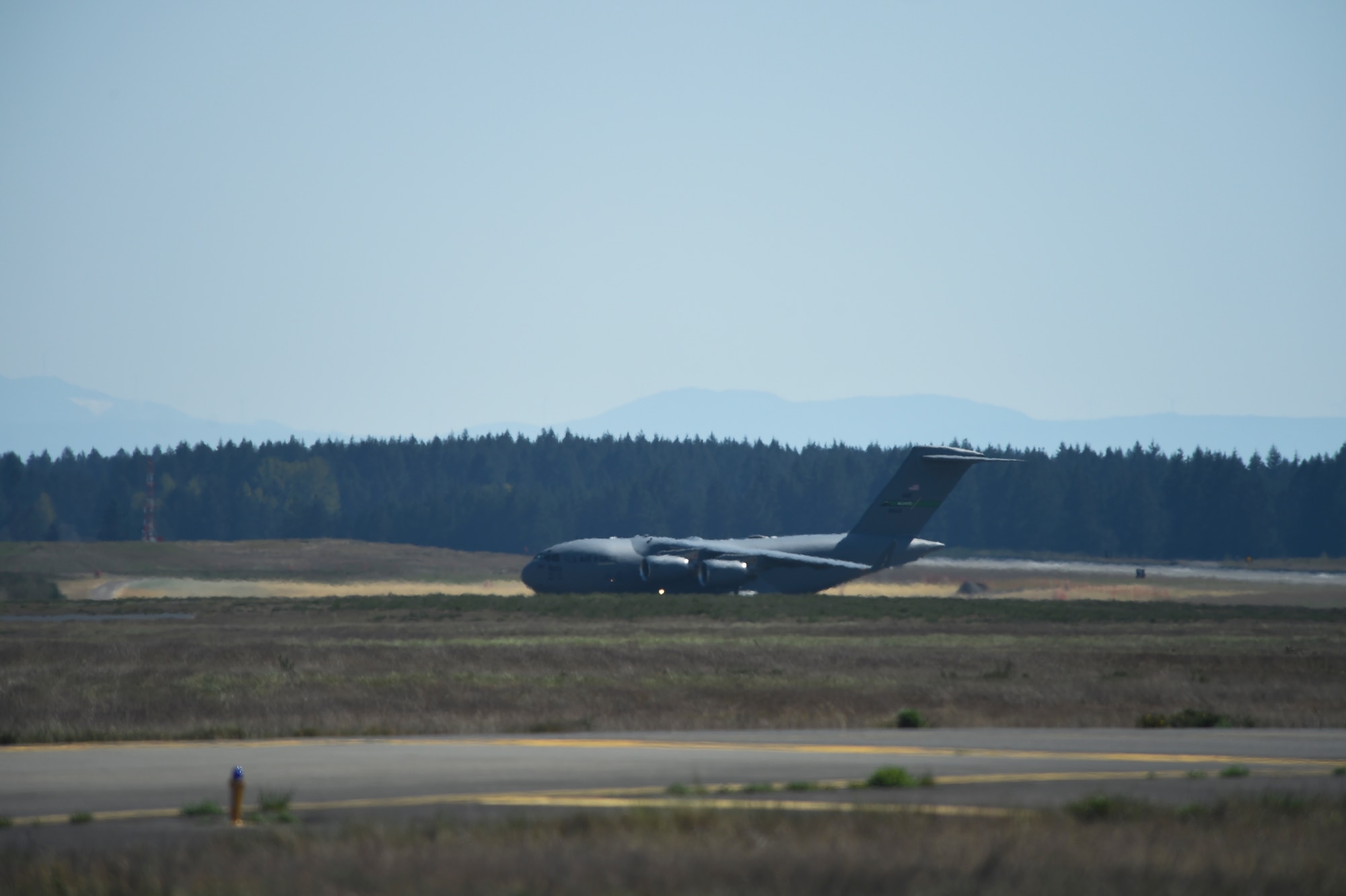 A C-17 Globemaster III assigned to the 62nd Airlift Wing taxis for a wet-wing defuel procedure on the flightline at Joint Base Lewis-McChord, Washington, April 21, 2021, as part of Exercise Rainier War. For the first time in Team McChord’s history, Airmen with the 62nd AW and 627th Air Base Group demonstrated a wet-wing defuel procedure on a C-17. (U.S. Air Force photo by Master Sgt. Julius Delos Reyes)