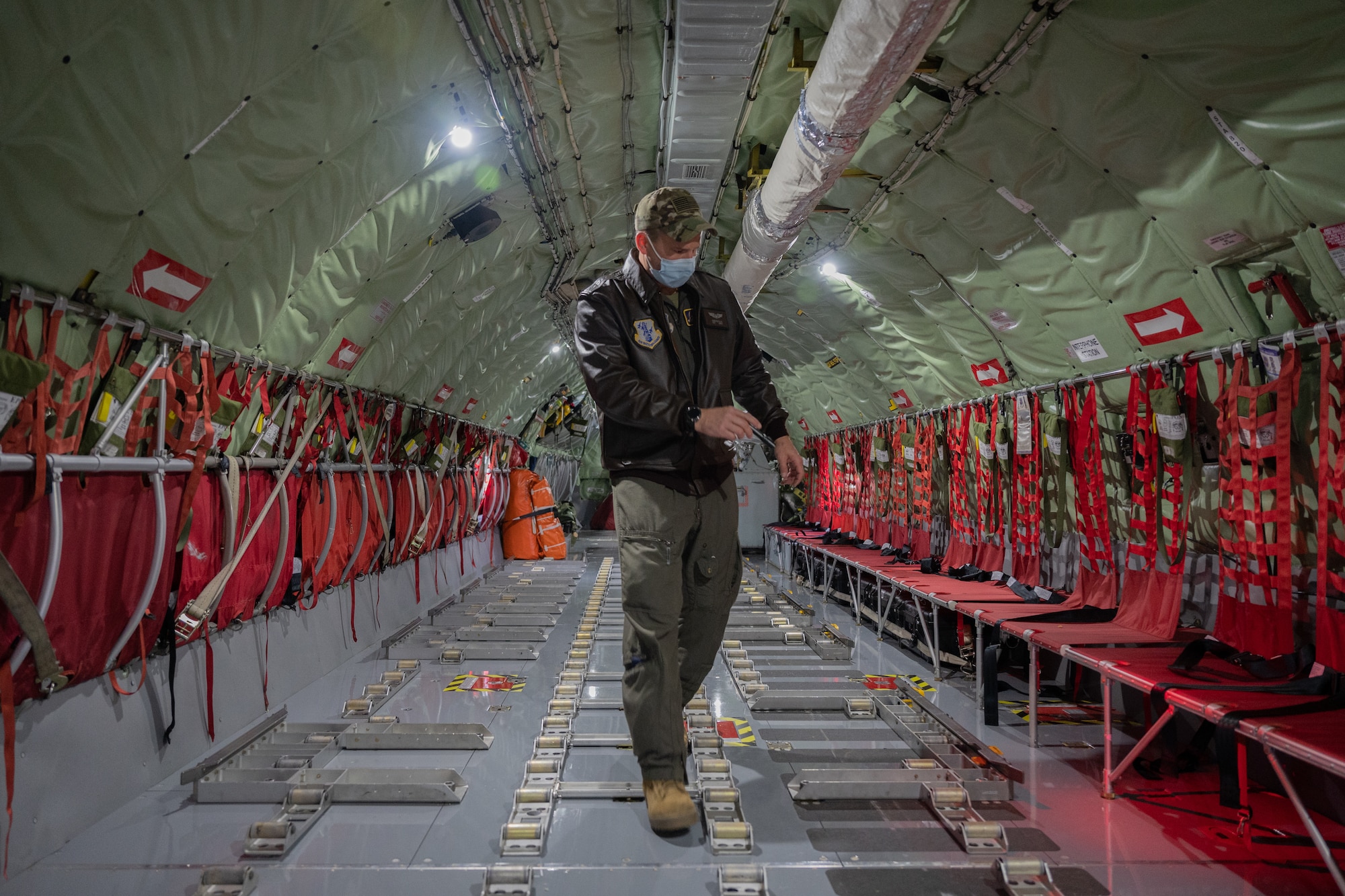 Airman walking in an aircraft.