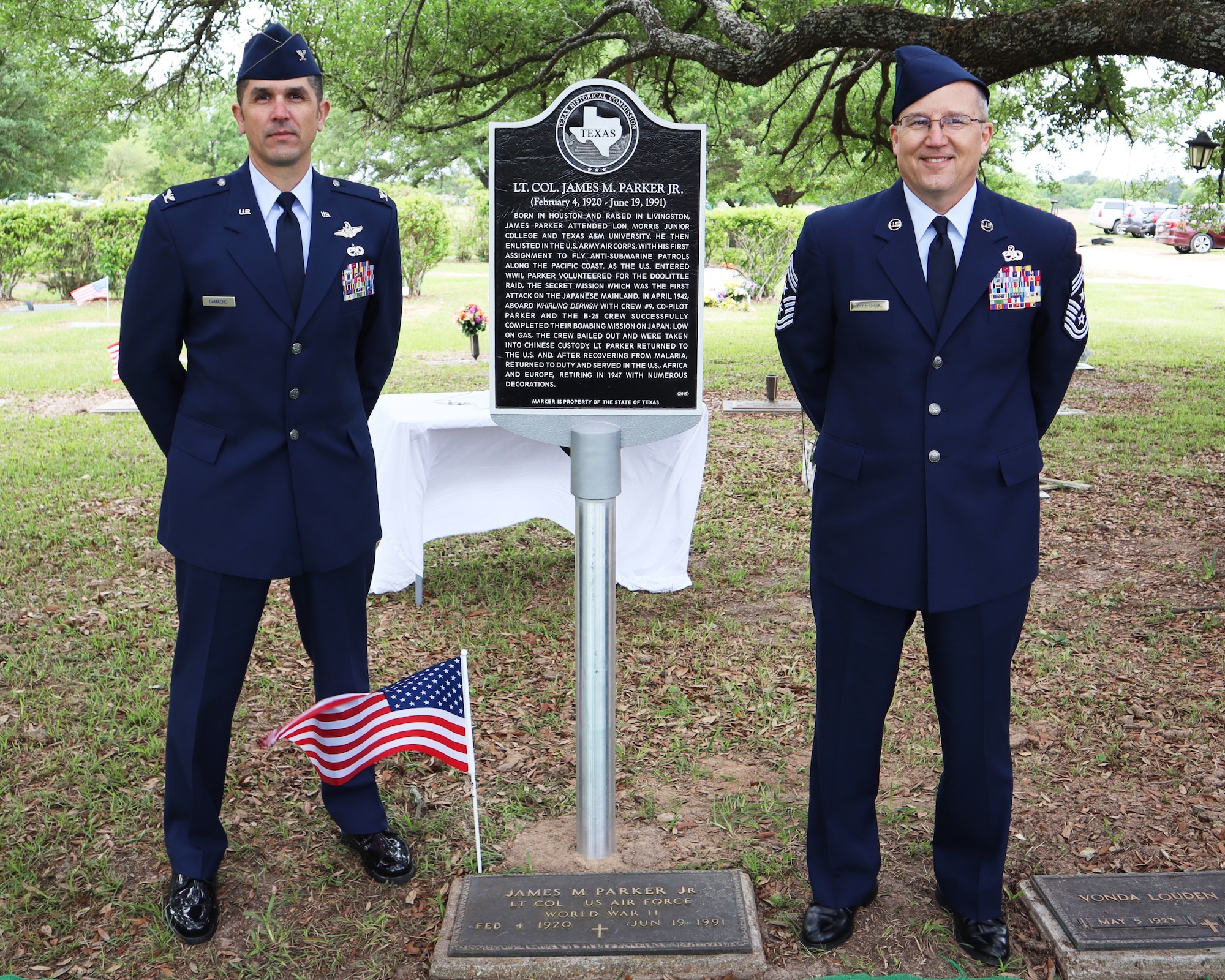 Col Andrew Camacho, 147th Attack Wing Commander, and Chief Master Sgt. Walter Zelezniak, 147th Attack Wing Command Chief, participate in an event honoring Lt. Col James M. Parker, Jr., a WWII veteran who is laid to rest in Livingston, TX, April 17, 2021