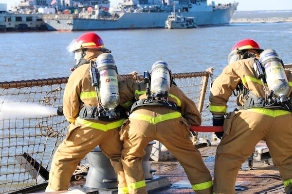 NAVAL STATION NORFOLK (April 15, 2021) -  Sailors aboard the Arleigh Burke-class, guided-missile destroyer USS Oscar Austin (DDG 79) participate in damage control drills. Newly-reported Sailors undergo a series of evolutions and drills testing their knowledge following command indoctrination. The Sailors then receive their command patch at the completion of drills and evolutions. (U.S. Navy photo courtesy of USS Oscar Austin Public Affairs/Released)