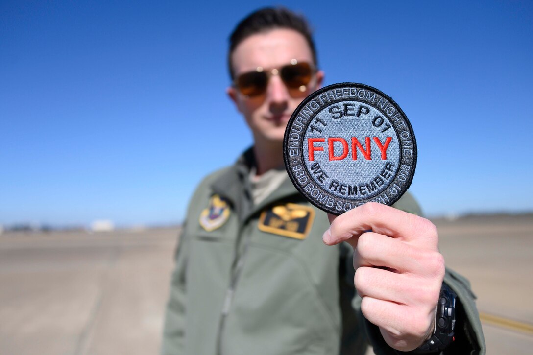 Photo of Airman standing outside a B-52