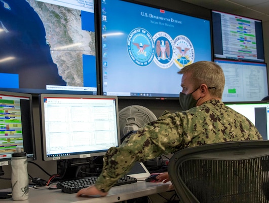 Lt. Cmdr. Michael Asche locates the MANTAS T38 Devil Ray unmanned surface vehicle from the U.S. 3rd Fleet Joint Operations Center as part of U.S. Pacific Fleet's Unmanned Systems Integrated Battle Problem 21.