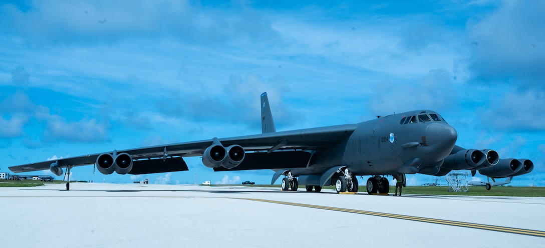An airplane is parked on a runway.