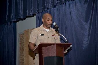 NEWPORT, R.I. (April 22, 2021) Capt. Alexis Walker, prospective commanding officer, Surface Warfare Schools Command (SWSC), reads his orders during the SWSC change of command ceremony at Naval Station (NAVSTA) Newport R.I., April 22, 2021. During the ceremony, Walker relieved Capt. Christopher Alexander as SWSC’s commanding officer. (U.S. Navy photo by Mass Communication Specialist 2nd Class Derien C. Luce)