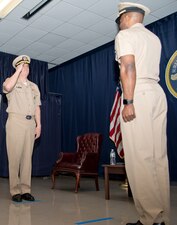 NEWPORT, R.I. (April 22, 2021) Capt. Christopher Alexander (left), salutes Capt. Alexis Walker as he relinquishes command of Surface Warfare Schools Command (SWSC) during a change of command ceremony at Naval Station (NAVSTA) Newport R.I., April 22, 2021. SWSC prepares sea bound Sailors to serve on surface combatants as officers, enlisted engineers, and enlisted navigation professionals to fulfill the Navy’s mission to maintain global maritime superiority. (U.S. Navy photo by Mass Communication Specialist 2nd Class Derien C. Luce)