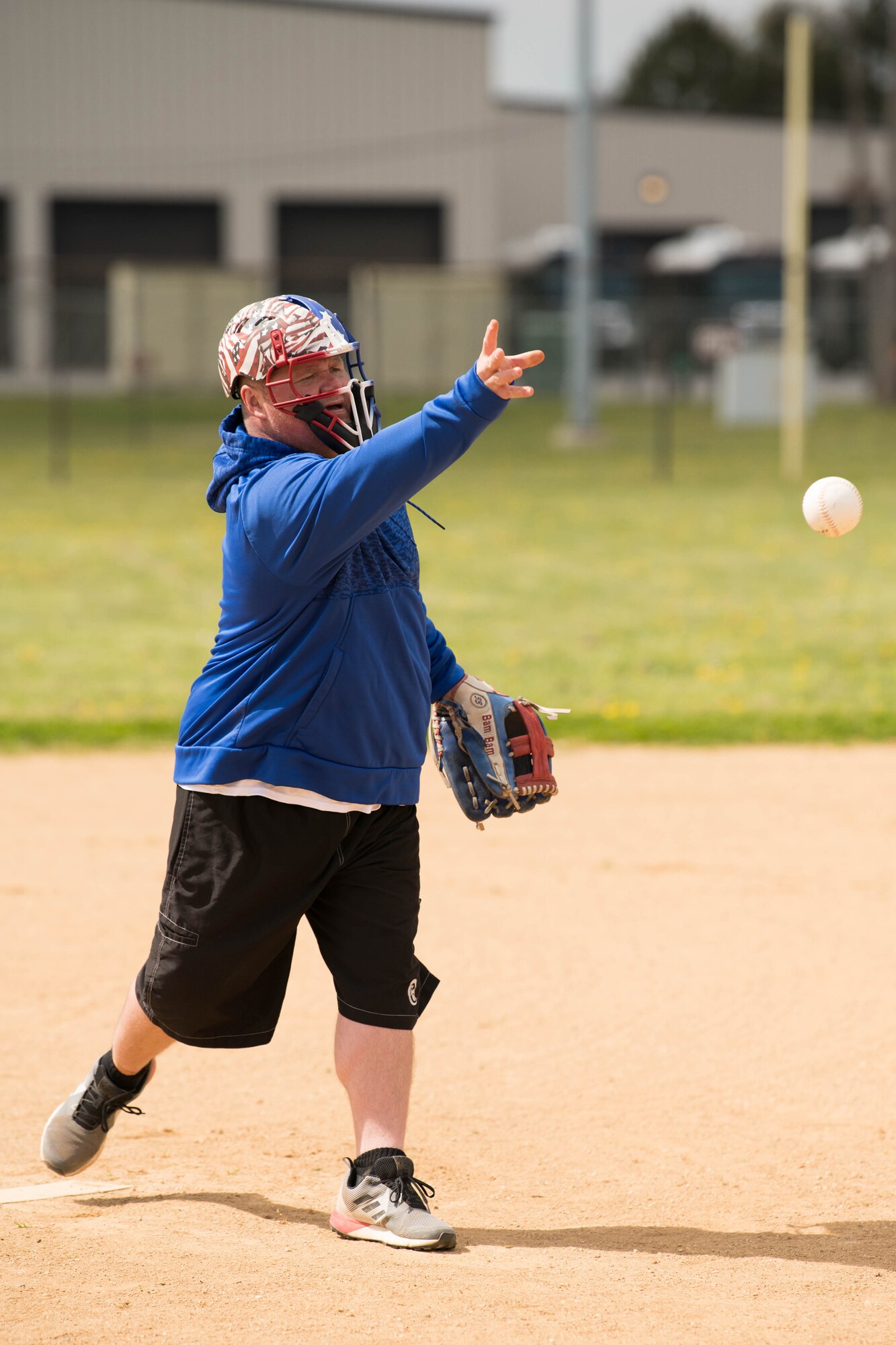 Chief Master Sgt. Christoper Kerstetter, 436th Maintenance Squadron, pitches during the Colonels vs. Chiefs softball game at Dover Air Force Base, Delaware, April 16, 2021. The Chiefs won the game 15-6. (U.S. Air Force photo by Mauricio Campino)