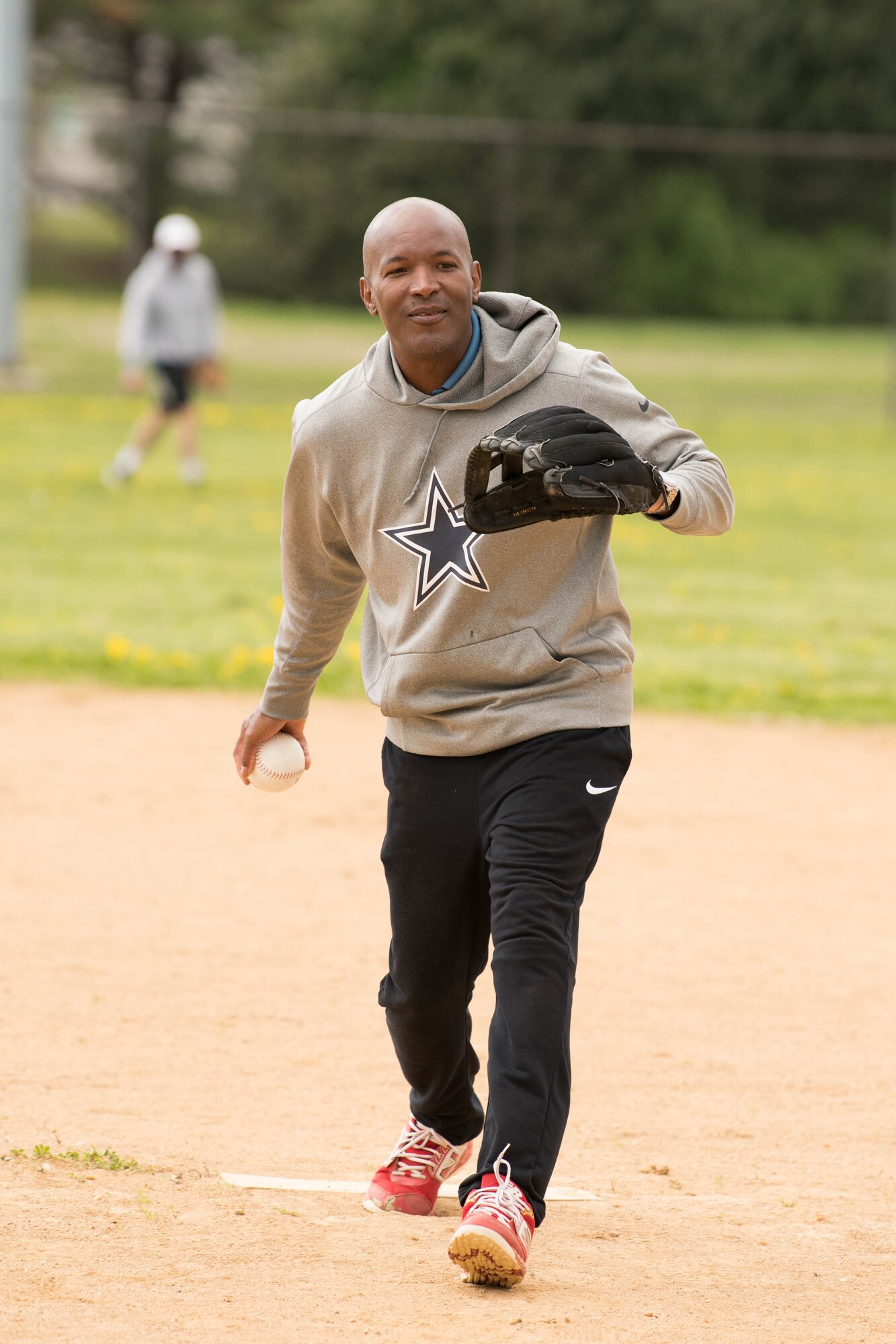 Col. Phelemon Williams, 436th Mission Support Group commander, pitches during the Colonels vs. Chiefs softball game at Dover Air Force Base, Delaware, April 16, 2021.  The Chiefs won the game 15-6. (U.S. Air Force photo by Mauricio Campino)
