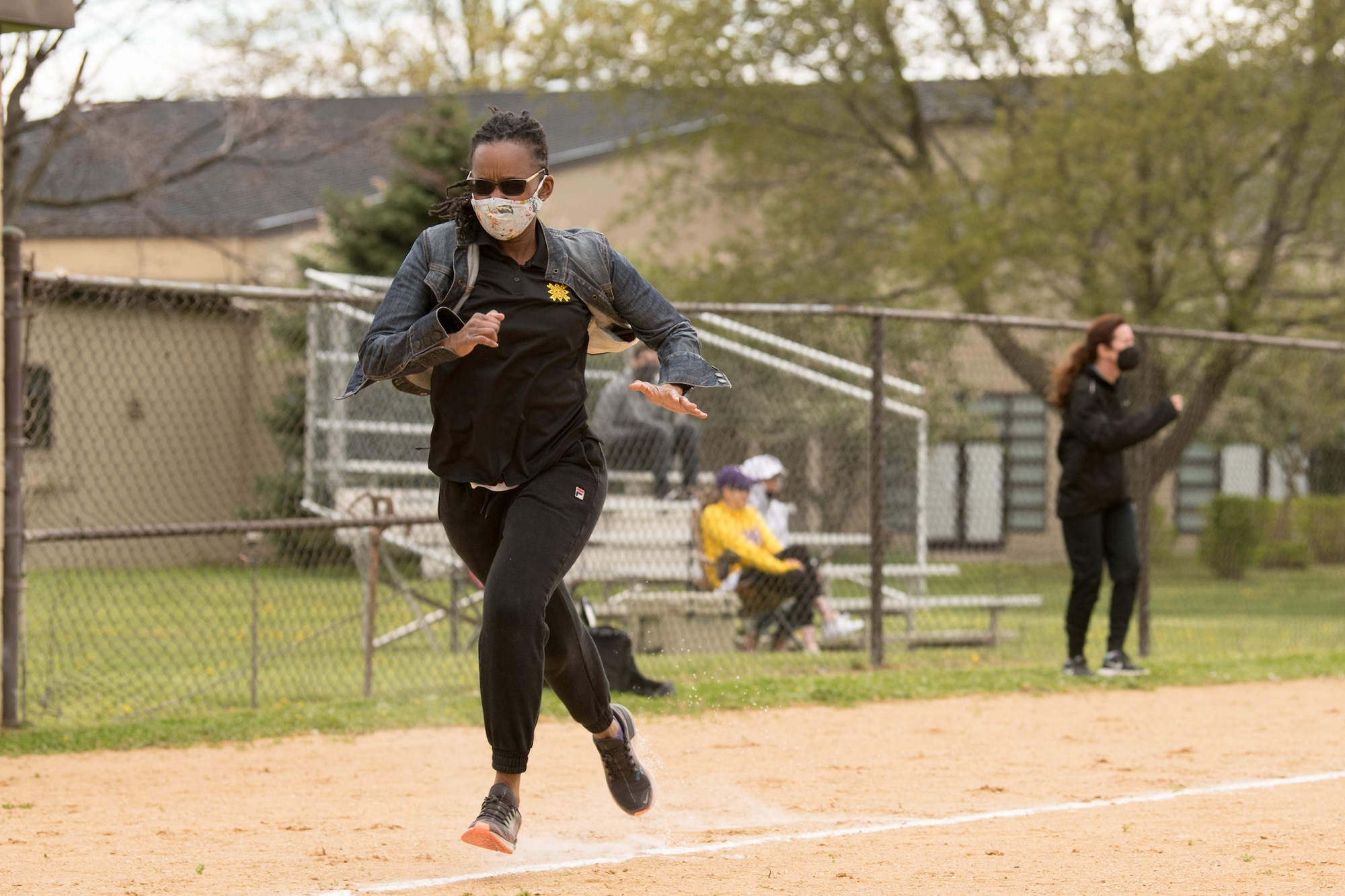 Col. Naomi Dennis, 436th Airlift Wing staff judge advocate, sprints home during a Colonels vs. Chiefs softball game at Dover Air Force Base, Delaware, April 16, 2021. The Chiefs won the game 15-6. (U.S. Air Force photo by Mauricio Campino)