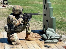 soldier fires M16