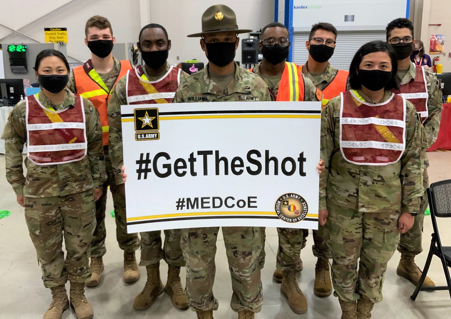 Staff Sgt. Marcus Williamson (center), a Drill Sergeant and 68J Medical Logistics Specialist assigned to Company C, 264th Medical Battalion, 32nd Medical Brigade, U.S. Army Medical Center of Excellence, or MEDCoE, pictured at the Brooke Army Medical Center’s Joint Base San Antonio-Fort Sam Houston Vaccine site with 68C Practical Nursing Specialists augmenting BAMC personnel to administer the Pfizer BioNTech COVID-19 vaccine April 15.