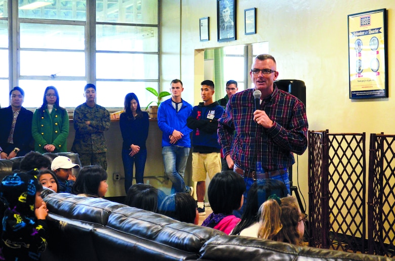 Col. Perry makes closing remarks in Japanese to the people from the local communities at the 38th Camp Schwab/USO Christmas Children’s Day in Camp Schwab USO Dec. 7, 2019.