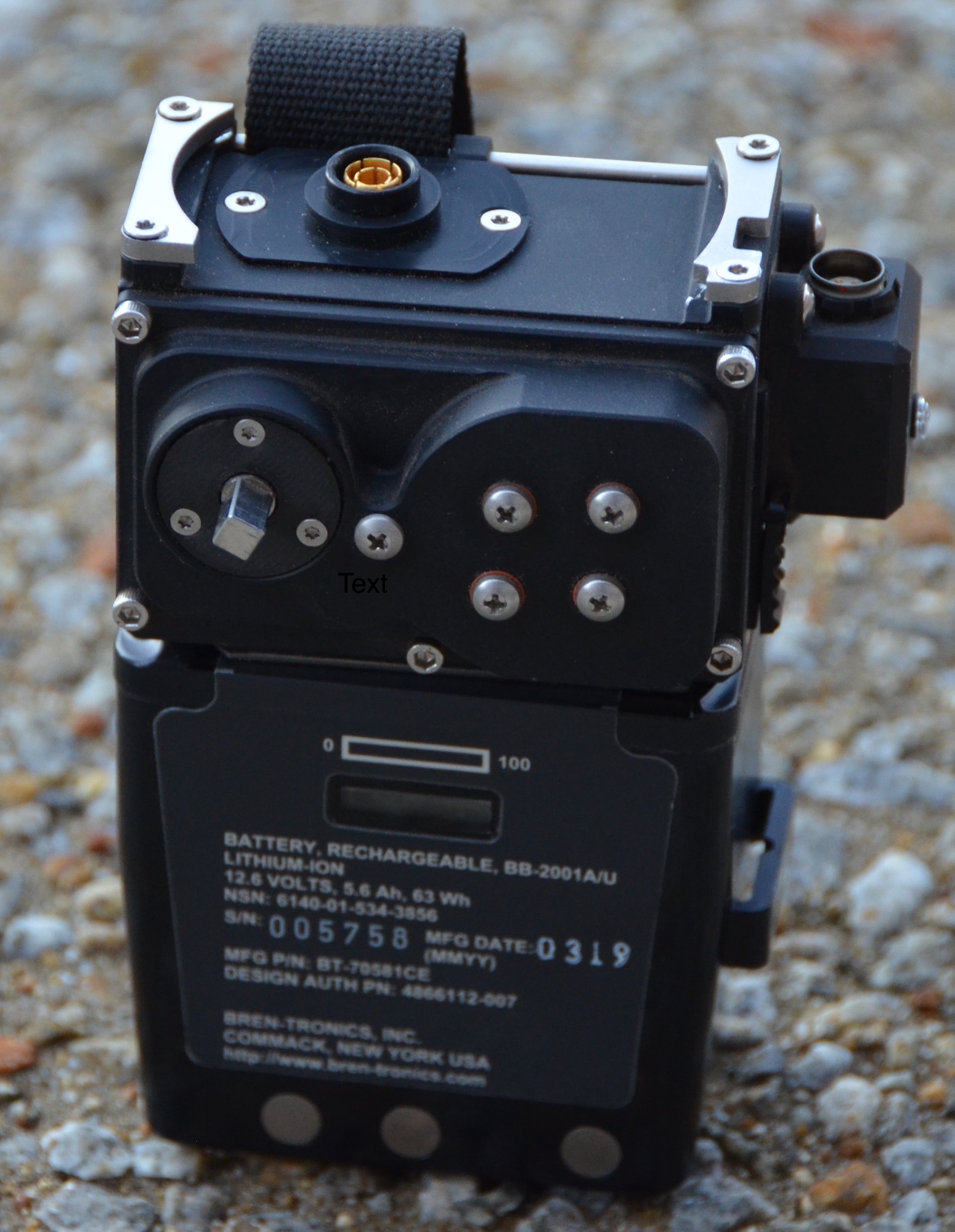 The portable “Surge Combat Survivor Evader Locator Tactical Charging Device” attaches to the CSEL radio’s battery, as shown here, providing compatibility for four different charging methods. (Photo courtesy of Combat Power Solutions, LLC)