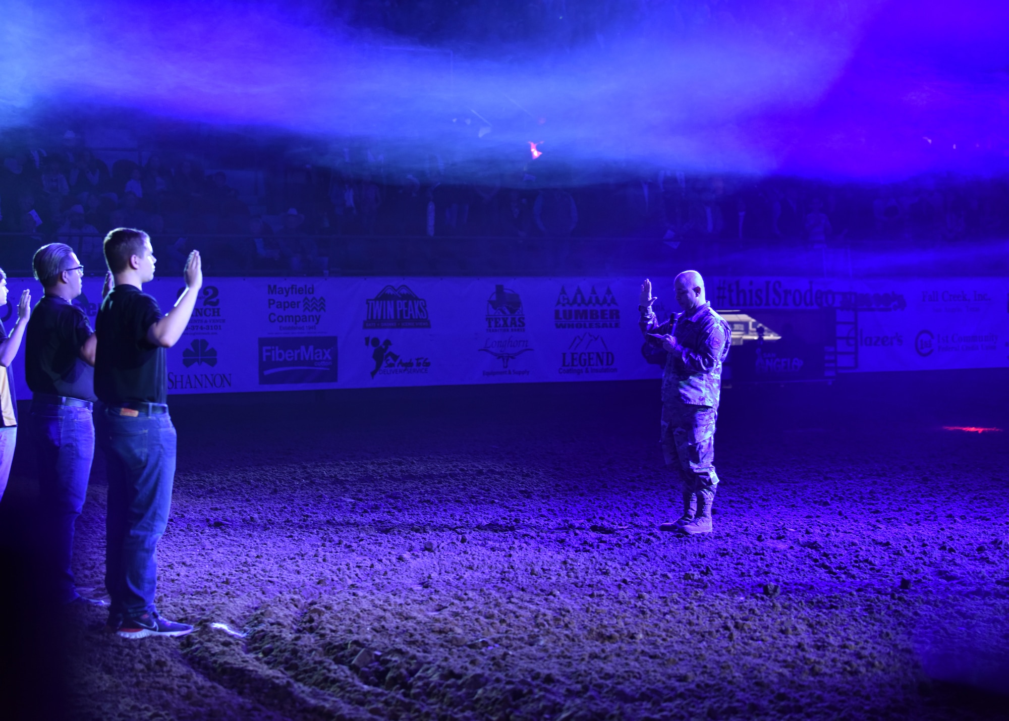 U.S Air Force Col. Andres Nazario, 17th Training Wing commander, swears in nine individuals during the rodeo opening event at the Foster Communications Coliseum in San Angelo Texas, April 21, 2021. At the rodeo, the San Angelo community hosted Military Appreciation Night to thank service members for defense of the country. (U.S. Air Force photo by Staff Sgt. Seraiah Wolf)