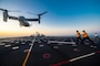 Sailors marshal an MV-22B Osprey assigned to Air Test and Evaluation (HX) Squadron 21 of Naval Air Station (NAS) Patuxent River, Md., on the ship's flight deck.