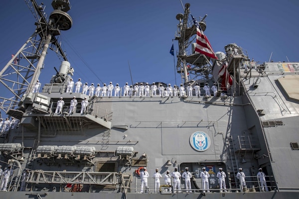 Sailors assigned to the guided-missile cruiser USS Philippine Sea (CG 58) man the rails as the ship pulls into Naval Station Mayport, Fla. Philippine Sea returned from a 10-month deployment to the U.S. 2nd, 5th, and 6th Fleet areas of operation.