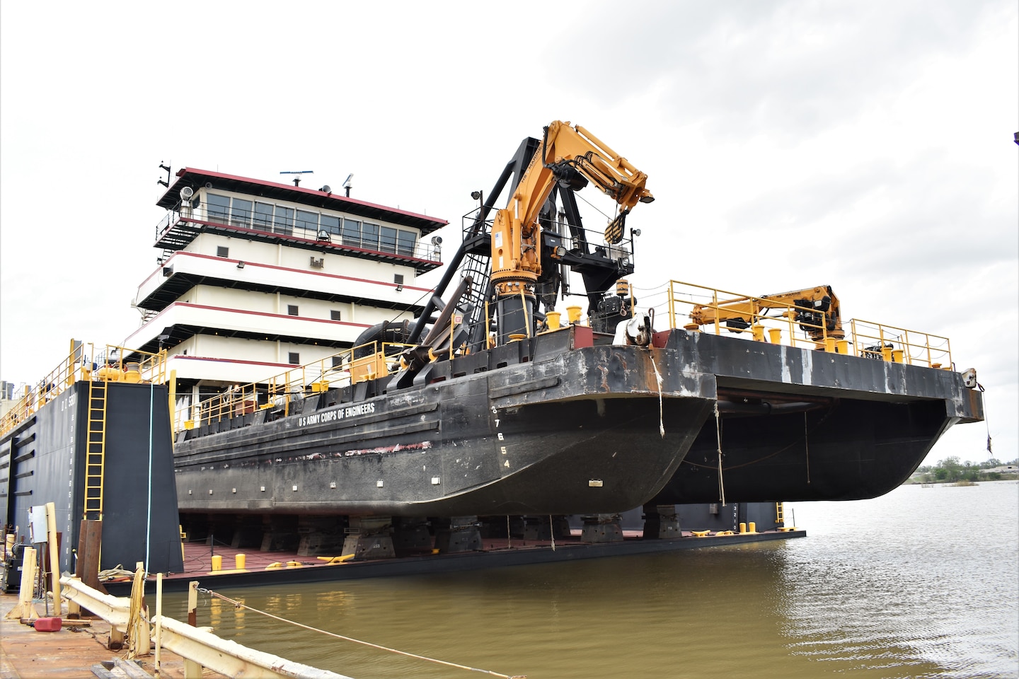 IN THE PHOTO, a photo of the Memphis District’s Dredge Hurley on the Ensley Engineer Yard dry dock, getting repaired after much of the south, including Memphis, Tennessee, was hit hard with frigid temperatures in mid-February this year. From frozen pipes to no electricity, many people and structures were impacted by the icy weather, including the district’s Dredge Hurley. It took approximately one month and multiple Ensley Engineer Yard crews to thaw out and repair the dredge. Now that the Dredge Hurley is thawed and repaired, it’s ready to dredge the Mississippi River, which is scheduled to start within the next two weeks. (USACE photo by Jessica Haas)