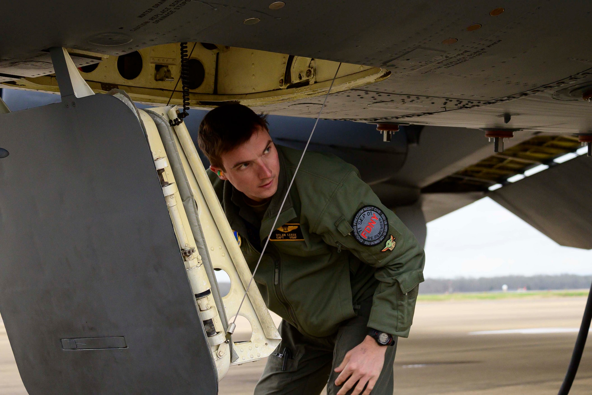 Photo of Airman standing outside a B-52