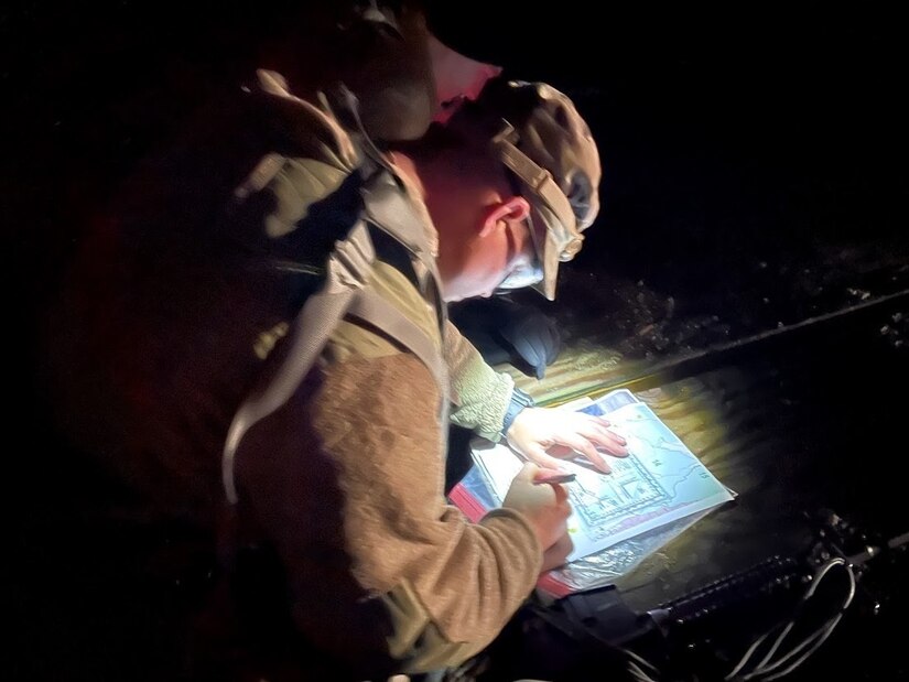 soldier plots night navigation points