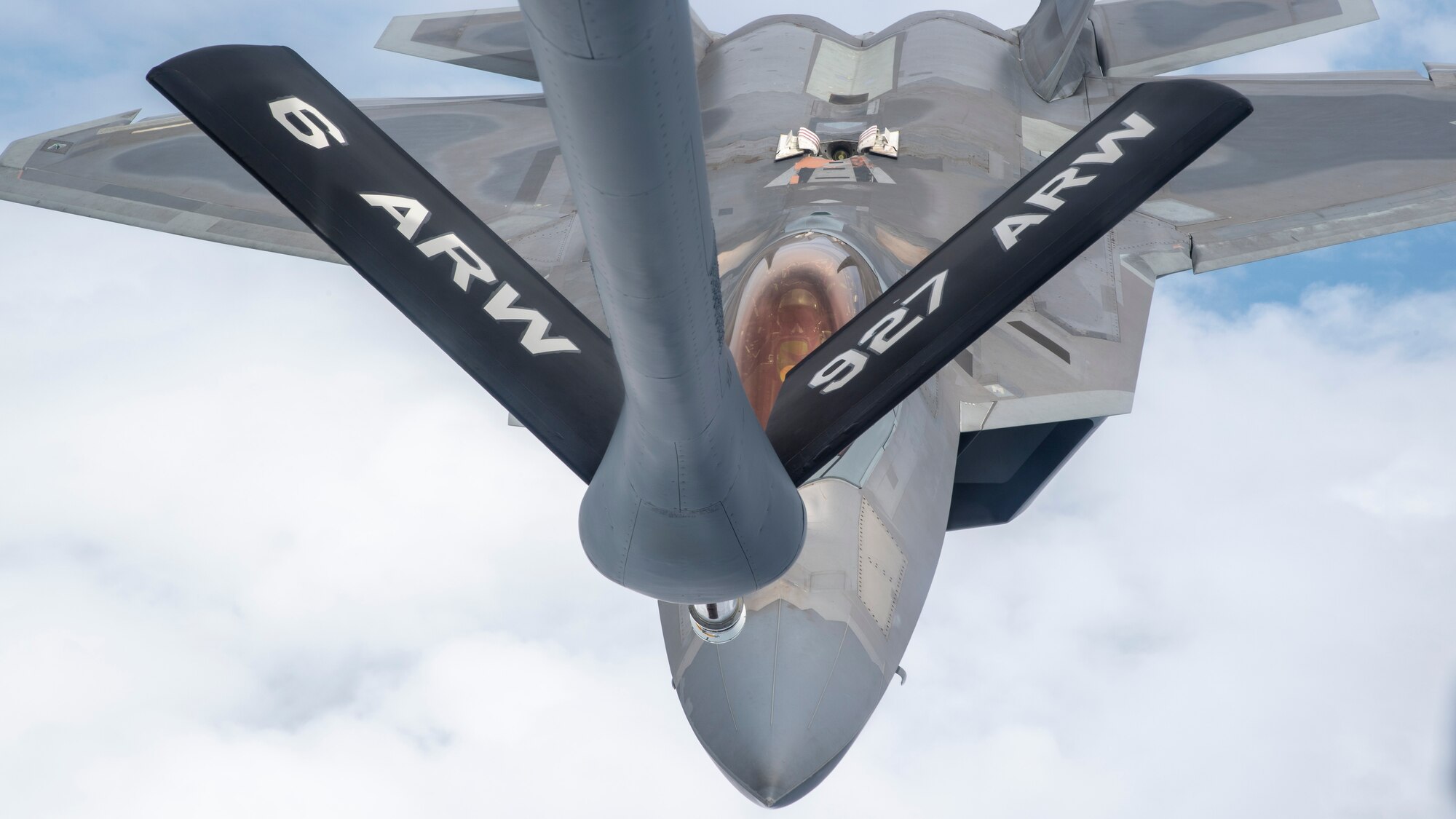 U.S. Air Force Maj. Joshua “Cabo” Gunderson, F-22 Raptor Demonstration Team commander, prepares to receive fuel from a MacDill Air Force Base, Fla., KC-135 Stratotanker, April 17, 2021.