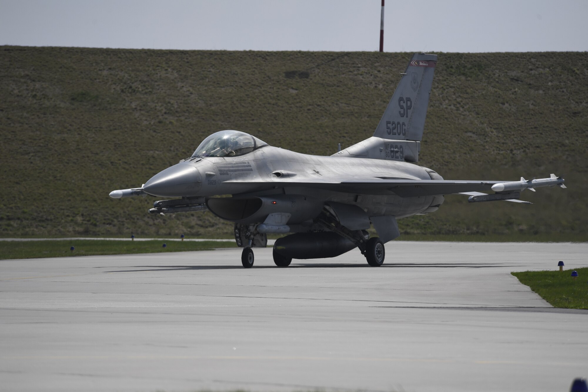 A U.S. Air Force F-16 Fighting Falcon from the from the 480th Fighter Squadron arrives at the 32nd Tactical Air Base during an Agile Combat Employment exercise at Łask Air Base, Poland, April 19, 2021.