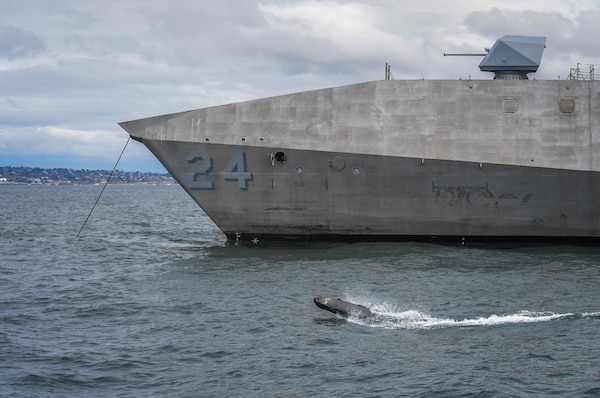 An ADARO unmanned system interacts with the Navy�s newest Independence-variant littoral combat ship USS Oakland (LCS 24) during U.S. Pacific Fleet�s Unmanned Integrated Battle Problem (UxS IBP) 21.