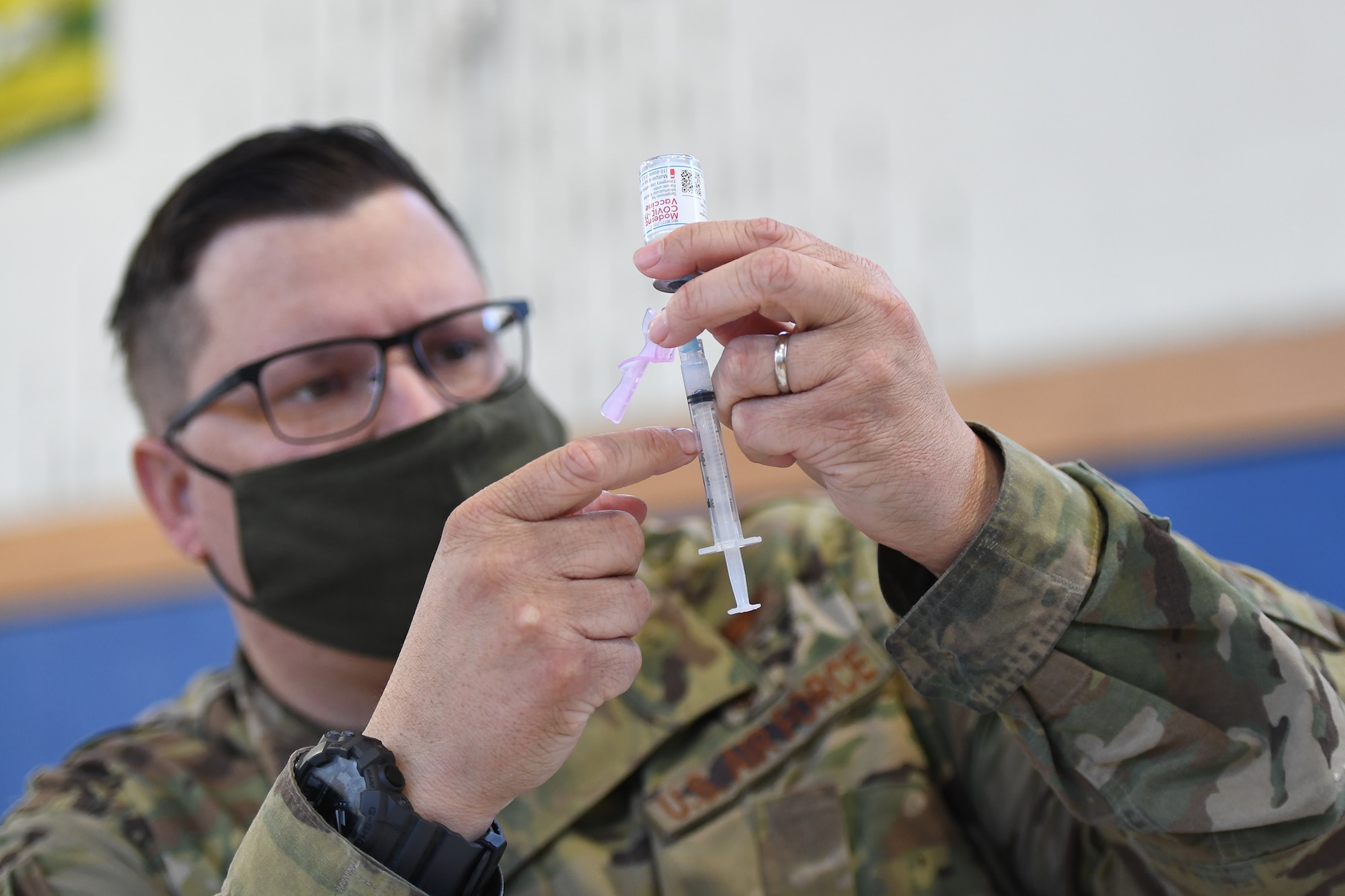 Master Sgt. Joshua Dennis, 66th Medical Squadron medical operations technician, prepares a COVID-19 vaccination dose at Hanscom Air Force Base, Mass., April 9. The 66 MDS currently has an increased vaccine availability for all personnel with a valid Department of Defense identification card. (U.S. Air Force photo by Mark Herlihy)