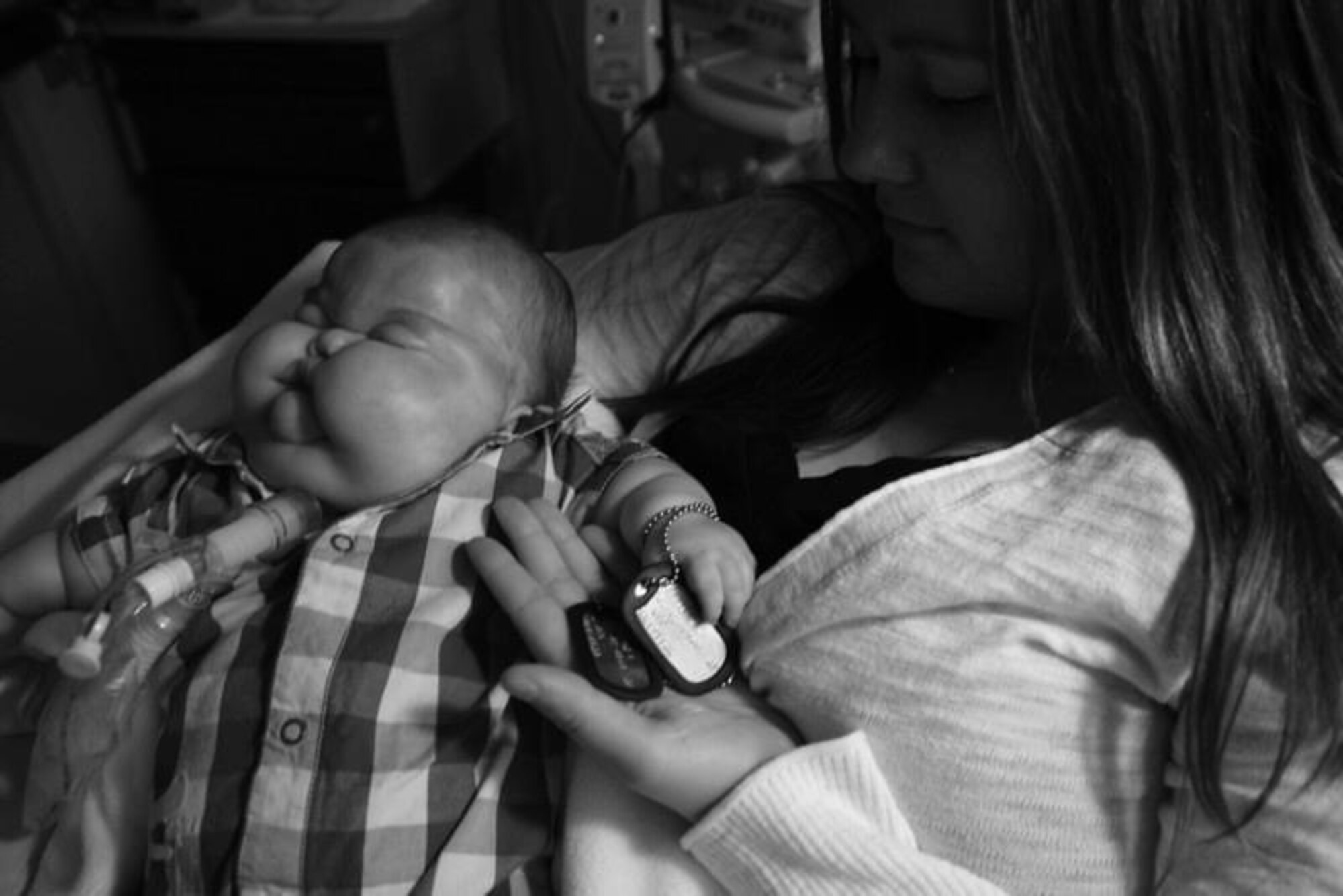 U.S. Air Force Master Sgt. Jessica Roy, 103rd Security Forces Squadron S2 intelligence and investigations superintendent and antiterrorism program manager, with her son Austin on the day of his passing at the Connecticut Children’s Medical Center pediatric intensive care unit in Hartford, Connecticut, April 1, 2012. Roy has dedicated the years following her infant son’s passing to advocacy work with the March of Dimes organization. (Courtesy photo)