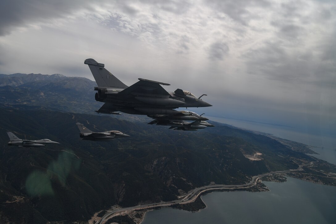 Aircraft from multiple countries participating in INIOCHOS 21 fly in formation over Greece, April 22, 2021. The Hellenic air force-lead INIOCHOS 21 is a multinational exercise designed to enhance the interoperability and skills of allied and partner air forces. The exercise assists in the accomplishment of future joint operations and air defenses, maintaining joint readiness and reassuring regional allies and partners. (U.S. Air Force photo by Airman 1st Class Thomas S. Keisler IV)