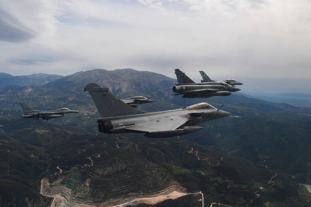 Aircraft from multiple countries participating in INIOCHOS 21 fly in formation over Greece, April 22, 2021. Participation in INIOCHOS 21 helps U.S. Air Force pilots develop and improve air readiness and interoperability with allied and partner air forces. (U.S. Air Force photo by Airman 1st Class Thomas S. Keisler IV)