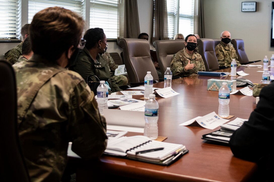 Chief Master Sgt. Barbara Gilmore, 932nd Airlift Wing, command chief, speaks with Gen. Jacqueline Van Ovost, Air Mobility Command, commander, during a mission brief at the 932nd AW at Scott Air Force Base, Illinois, April 10, 2021. During the mission brief leaders throughout the 932nd AW explained the overall mission of the wing. (U.S. Air Force photo by Senior Airman Brooke Spenner)