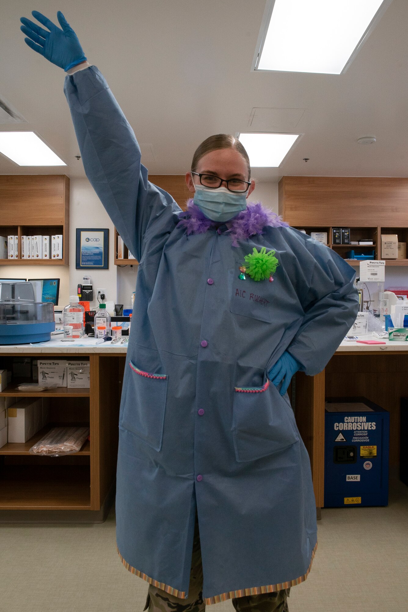 Airman 1st Class Shilea Ruchert, 27th Special Operations Healthcare Operations Squadron lab technician, poses to show off her custom lab coat she designed as part of Medical Laboratory Professionals Week at Cannon Air Force Base, N.M., April 18, 2021. Medical Laboratory Professionals Week is universally recognized as a way to celebrate and give thanks to those who work in medical labs and dedicate themselves to the health and welfare of all mankind. (U.S. Air Force photo by Airman 1st Class Christopher Storer)