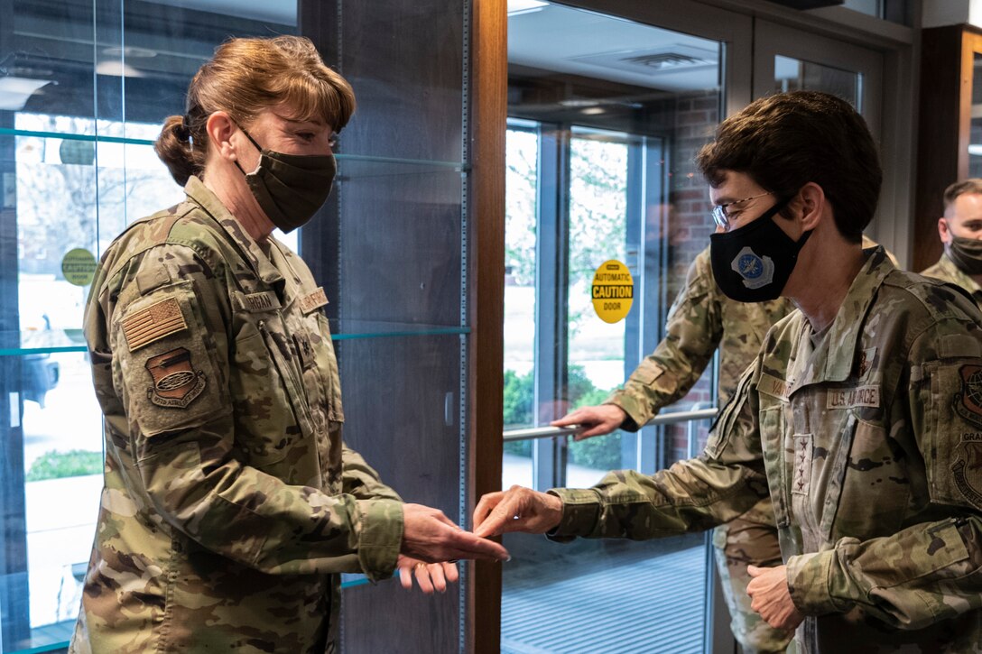 U.S. Air Force Gen. Jacqueline Van Ovost, Air Mobility Command commander, recognizes Lt. Col. Amy Morgan, 932nd Airlift Wing, executive staff officer, a star performer from the 932nd Airlift Wing, on April 10, 2021. Col. Chad Biehl, 932nd AW vice commander, nominated Morgan for her outstanding work assisting in making the Generals tour possible. (U.S. Air Force photo by Senior Airman Brooke Spenner)