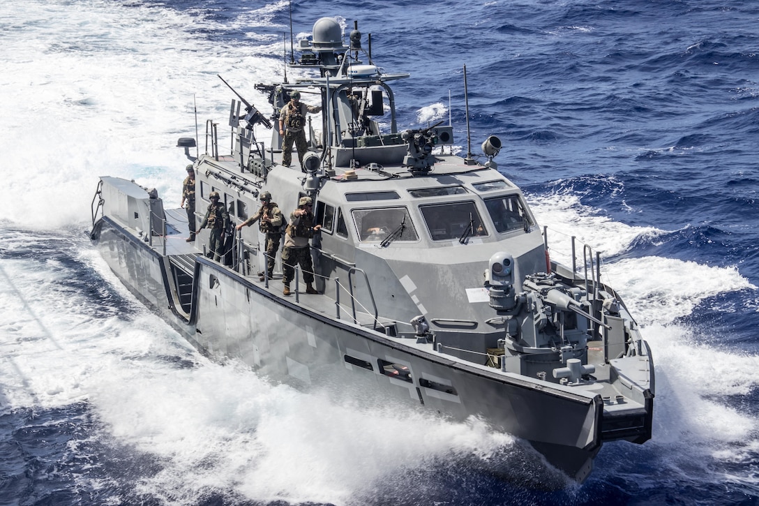 U.S. Sailors with Bravo Company, Maritime Expeditionary Security Squadron TWO, pull up alongside dock-landing ship USS Ashland (LSD 48) during a refueling operation in the Philippine Sea, Feb. 25, 2021. This refueling operation is the first time the USS Ashland (LSD 48) has refueled a Mark VI patrol boat while at sea. The 31st MEU is operating aboard ships of the Amphibious Squadron 11 in the 7th fleet area of operations to enhance interoperability with allies and partners and serve as a ready response force to defend peace and stability in the Indo-Pacific region.