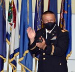 Chief Warrant Officer 5 Jesus C. Tulud reacts to a speaker during his retirement ceremony April 15 at Fort Detrick, Maryland. Tulud devoted the majority of his 33-year career to improving the Army’s medical logistics enterprise. (Photo Credit: C.J. Lovelace)