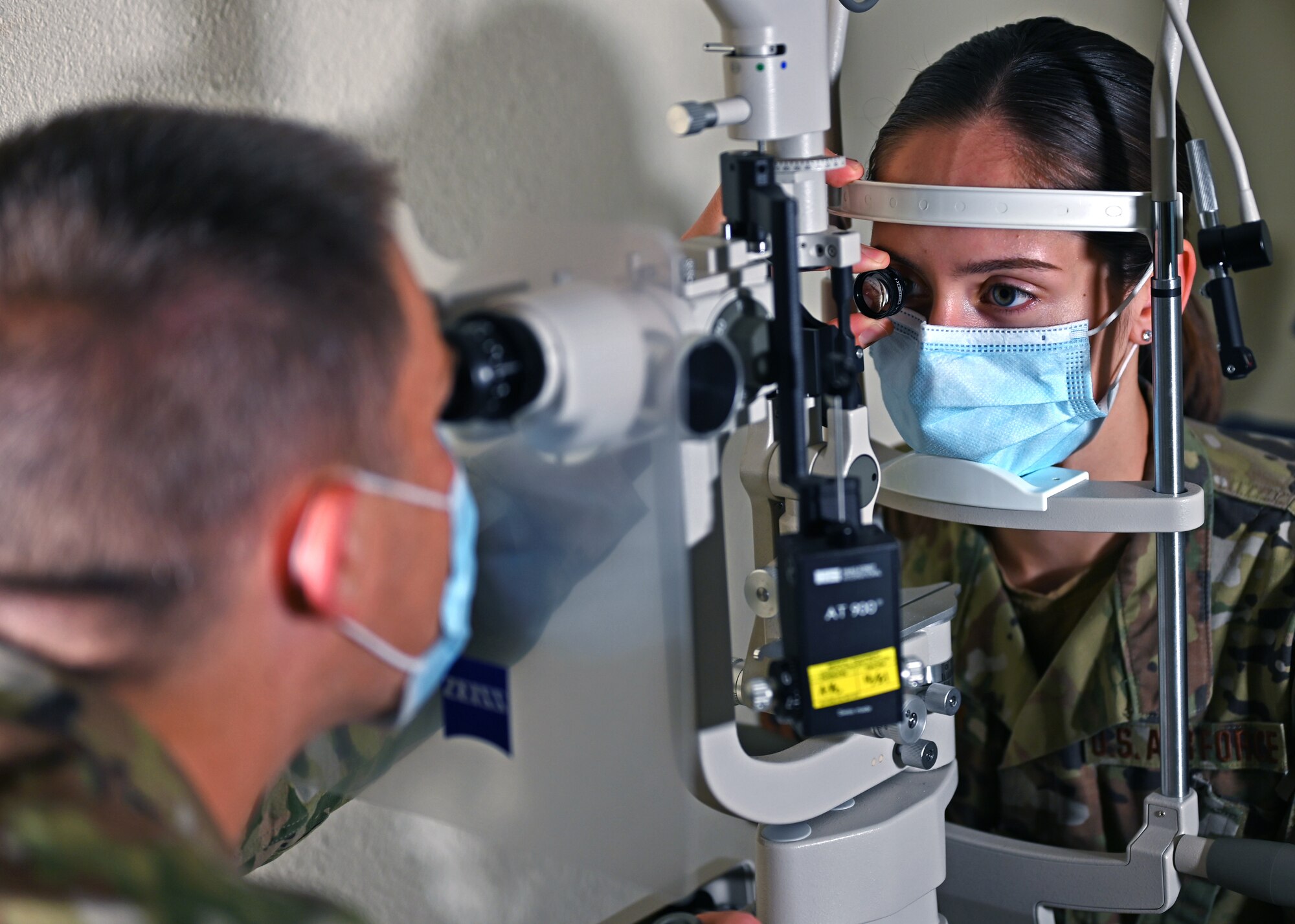 U.S. Air Force Capt. Paul Brown, 17th Medical Group optometry element chief, examines an Airman’s eye at the Ross Clinic on Goodfellow Air Force Base, Texas, April 19, 2021. Brown served as the sole optometrist on base.  (U.S. Air Force photo by Airman 1st Class Michael Bowman)