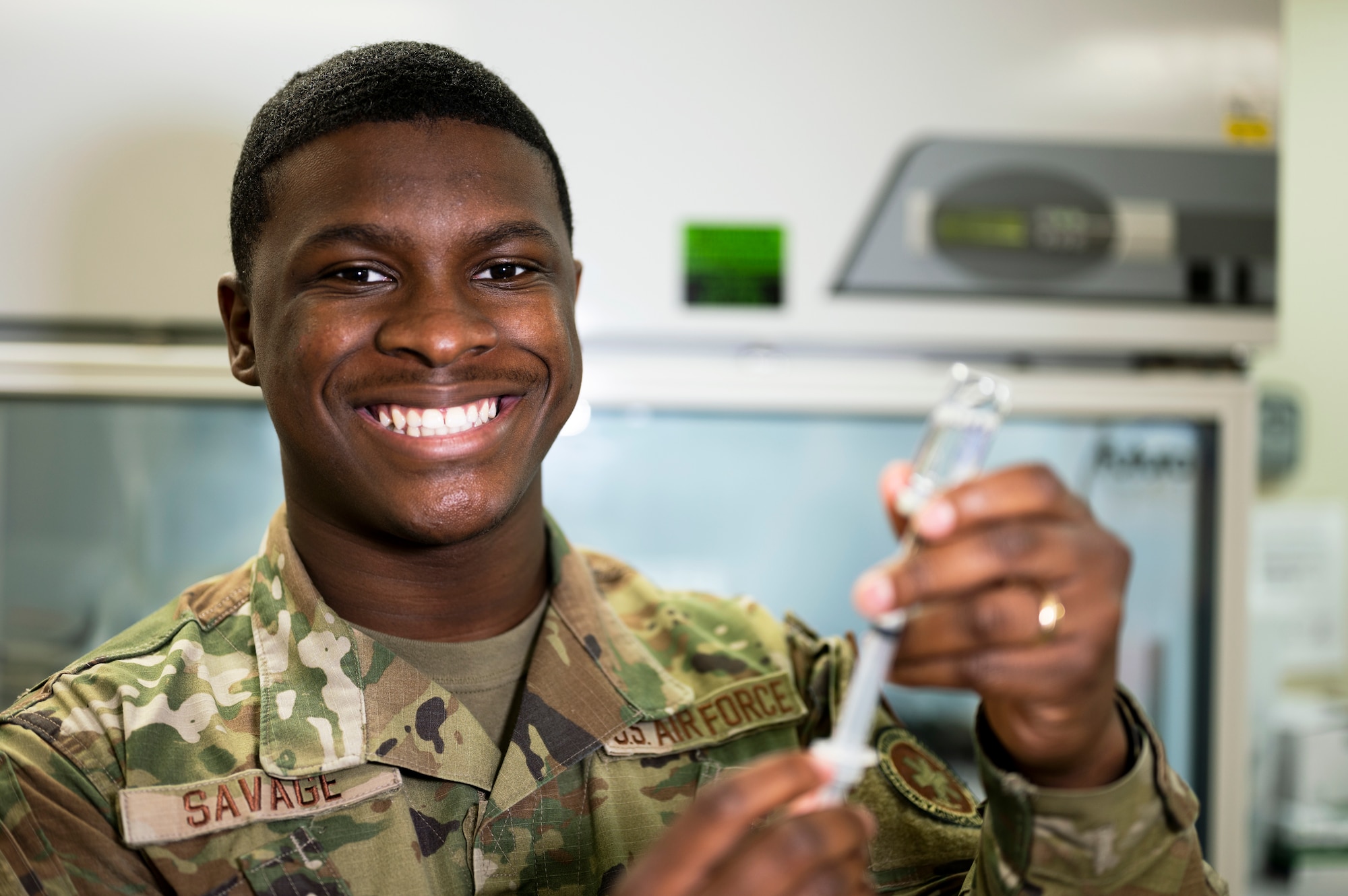 U.S. Air Force Senior Airman Micah Savage, 17th Medical Group immunizations technician, showcases his talents at the Ross Clinic on Goodfellow Air Force Base, Texas, April 19, 2021. Savage used personable interaction to help put patients at ease while being vaccinated. (U.S. Air Force photo by Airman 1st Class Michael Bowman)