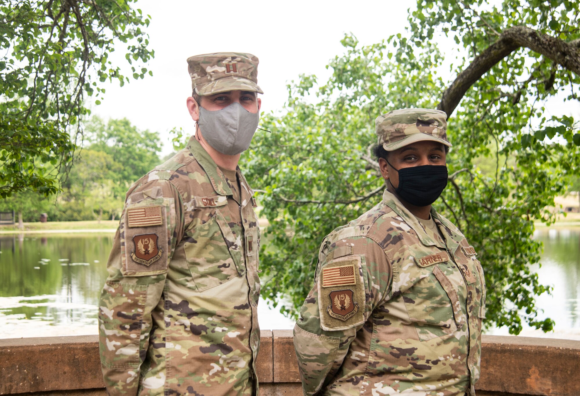 Photo of Airmen showing off their patches