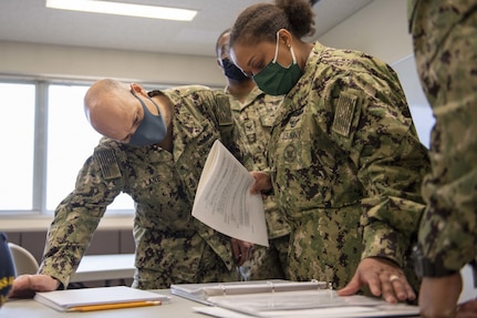 Senior Chief Navy Counselor Scott Lane, left, from Malvern, Ohio and Chief Navy Counselor Anita Felix, right, from Houston, both assigned to the forward-deployed amphibious assault ship USS America (LHA 6), proctor the Armed Services Vocational Aptitude Battery in the Fleet Activities Sasebo Community Educational Center. America, lead ship of the America Amphibious Ready Group, along with the 31st Marine Expeditionary Unit, is operating in the U.S. 7th Fleet area of responsibility to enhance interoperability with allies and partners and serve as a ready response force to defend peace and stability in the Indo-Pacific region