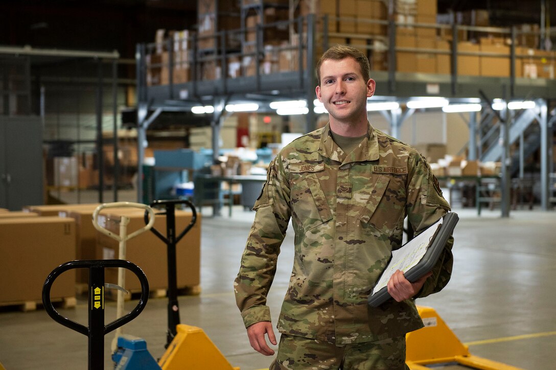 Airman 1st Class Orion Jones, 341st Logistics Readiness Squadron vehicle operator, poses for a photo in the 341st Logistics Readiness Squadron cargo hangar April 12, 2021, on Malmstrom Air Force Base, Mont.