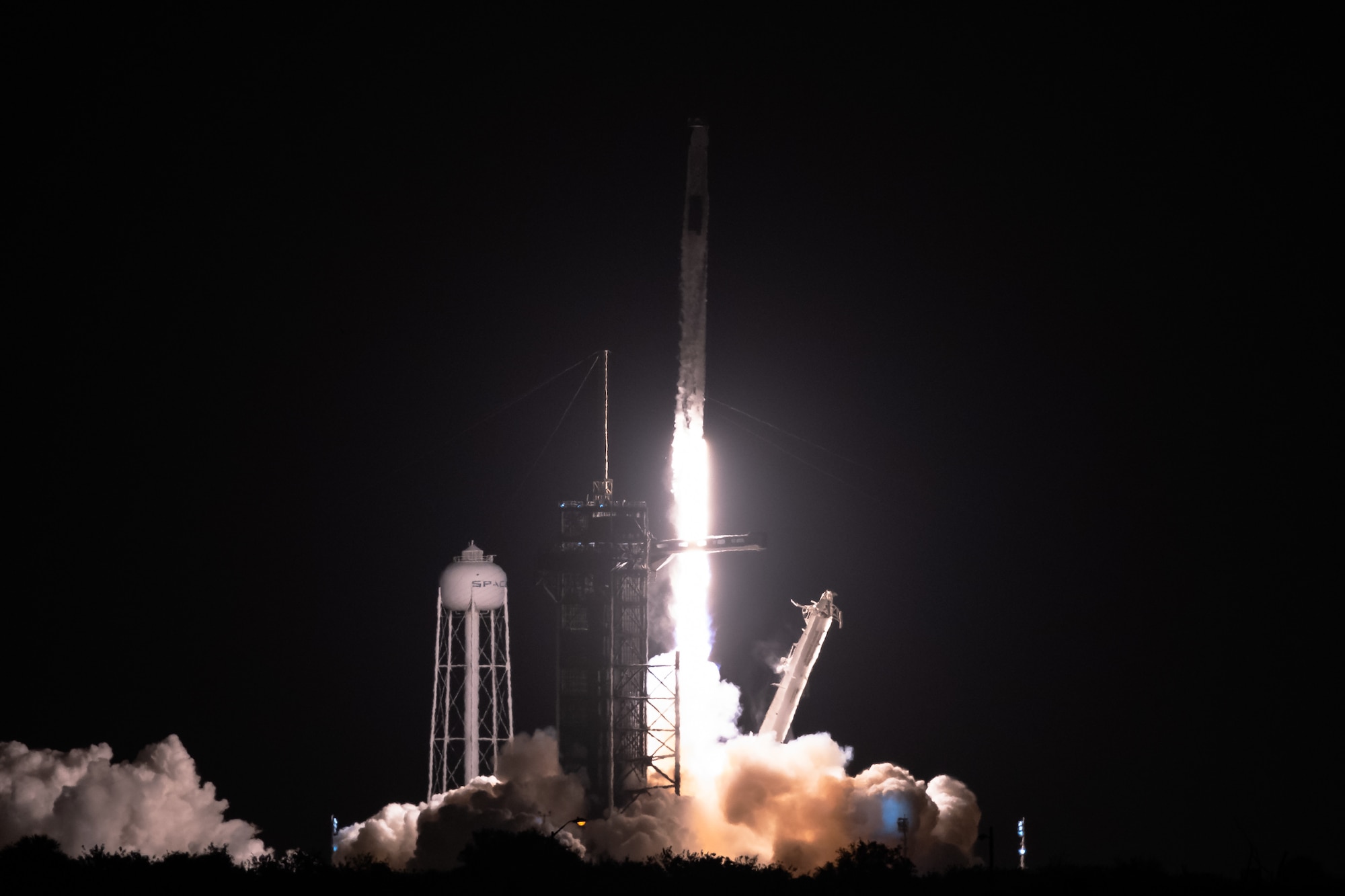 A SpaceX Falcon 9 rocket launches from Space Launch Complex 39A April 23, 2021, at Kennedy Space Center, Florida. The rocket launched the four members of Dragon Crew-2 into space. The astronauts will spend six months on the International Space Station performing a variety of experiments and maintenance actions. (U.S. Space Force photo by Joshua Conti)
