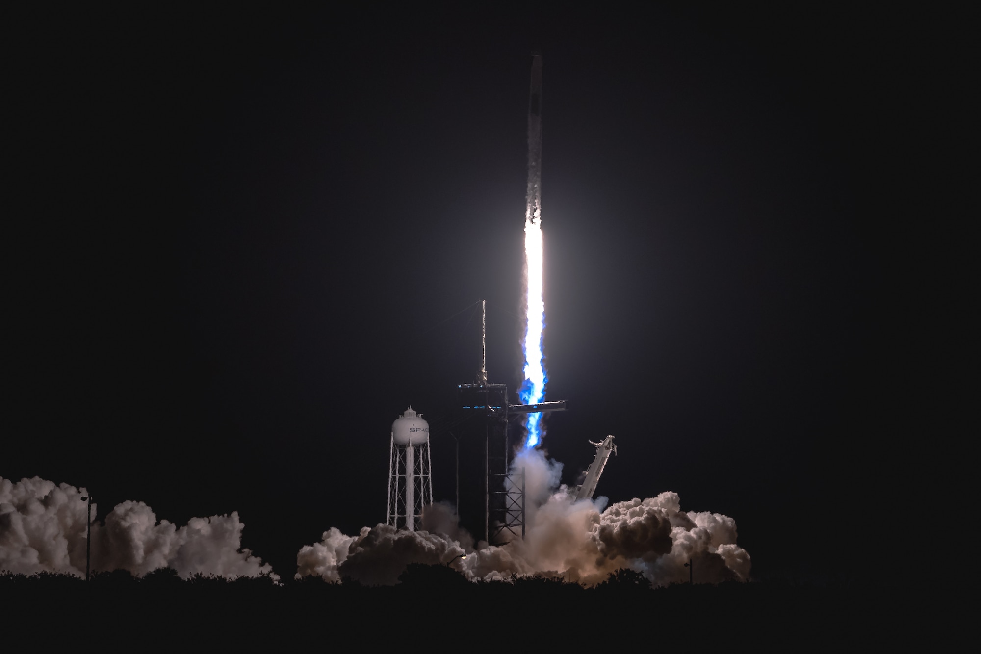A SpaceX Falcon 9 rocket launches from Space Launch Complex 39A April 23, 2021, at Kennedy Space Center, Florida. The rocket launched the four members of Dragon Crew-2 into space. The astronauts will spend six months on the International Space Station performing a variety of experiments and maintenance actions. (U.S. Space Force photo by Joshua Conti)